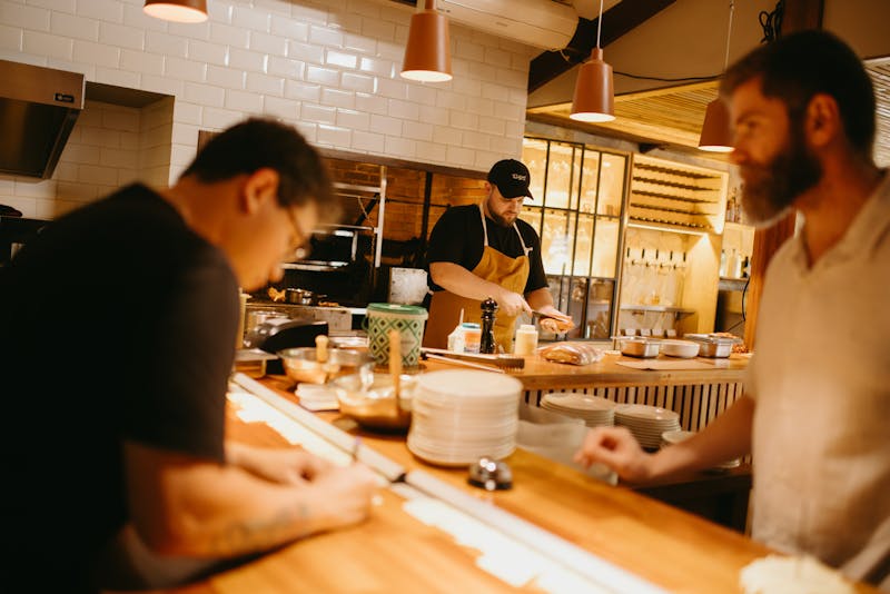 Papa Ginos team members working together in a vibrant restaurant environment