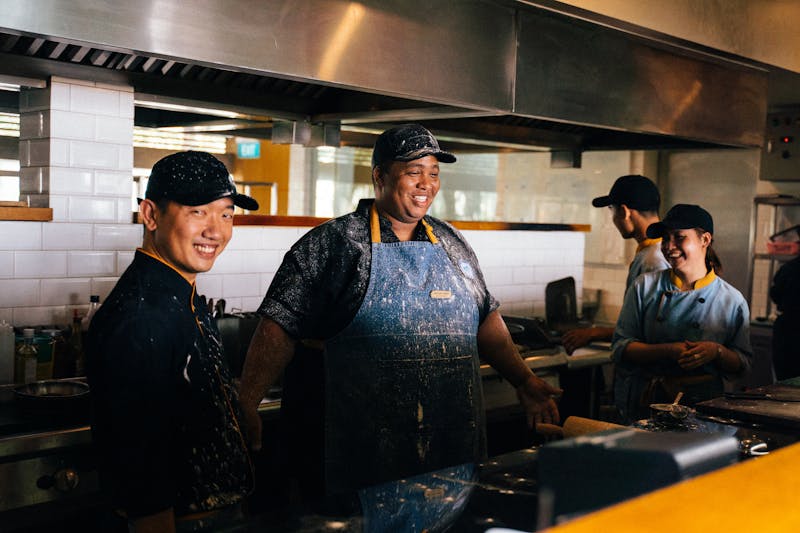 Papa Ginos team members smiling in the restaurant